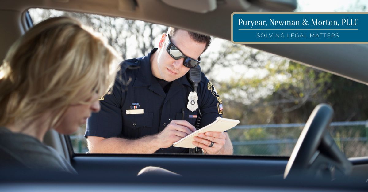 Law enforcement giving a ticket to a driver